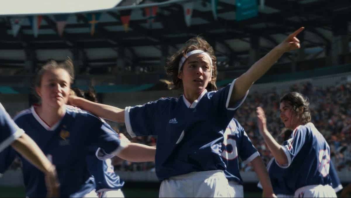 A woman playing football